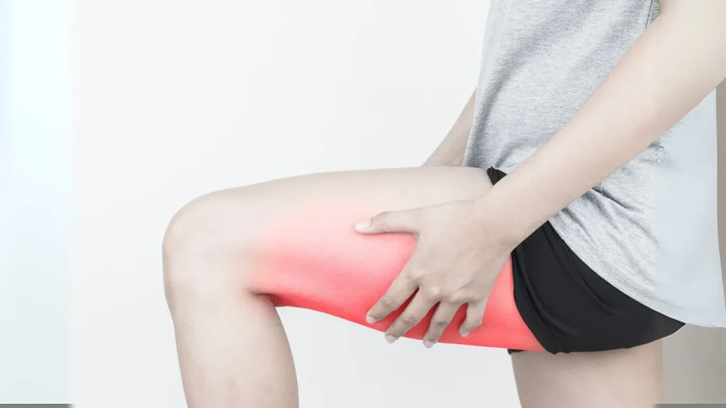 An athlete receiving shockwave therapy for hamstring injury recovery