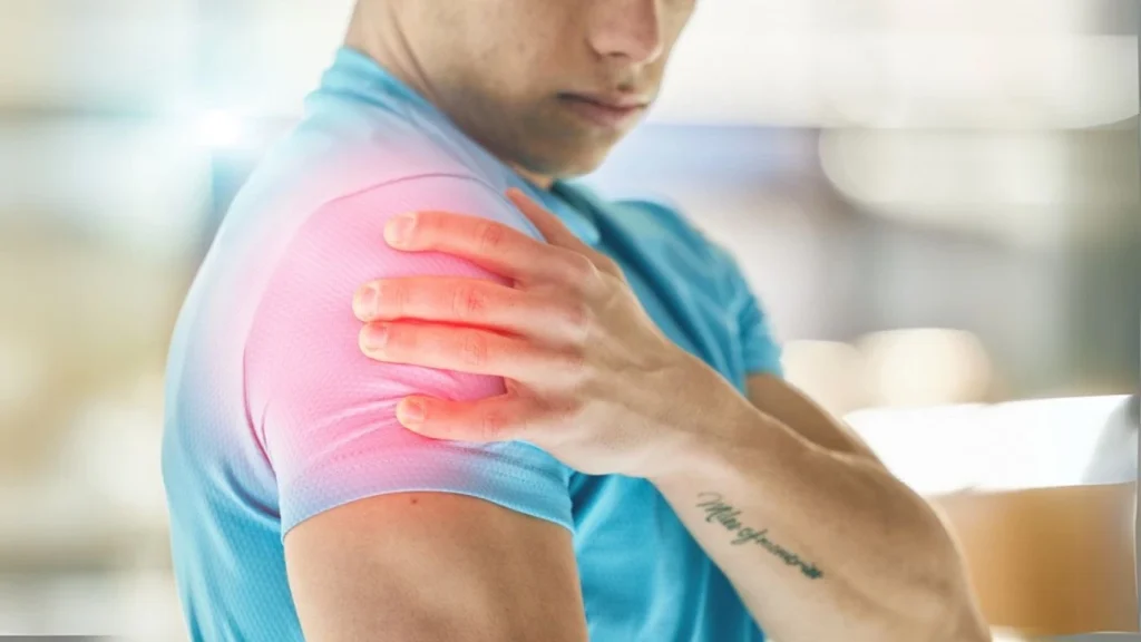 Man touching his shoulder with pain