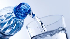Pouring water into a glass