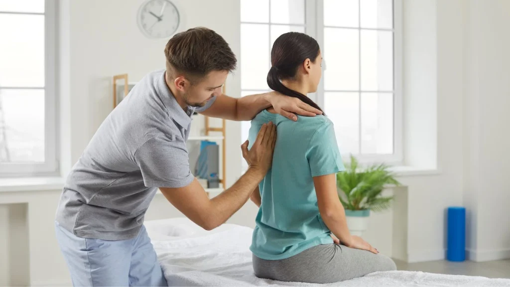 Chiropractor performing spinal adjustment on patient – benefits of using a chiropractor for pain relief and posture improvement