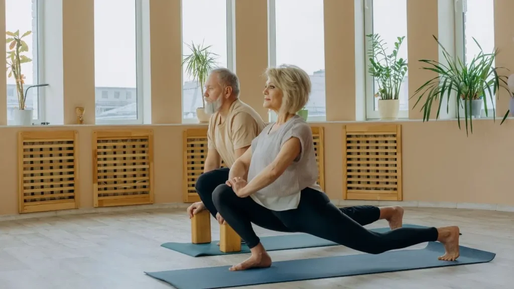 Older adults practicing yoga indoors as part of holistic approaches to managing chronic pain and improving mobility