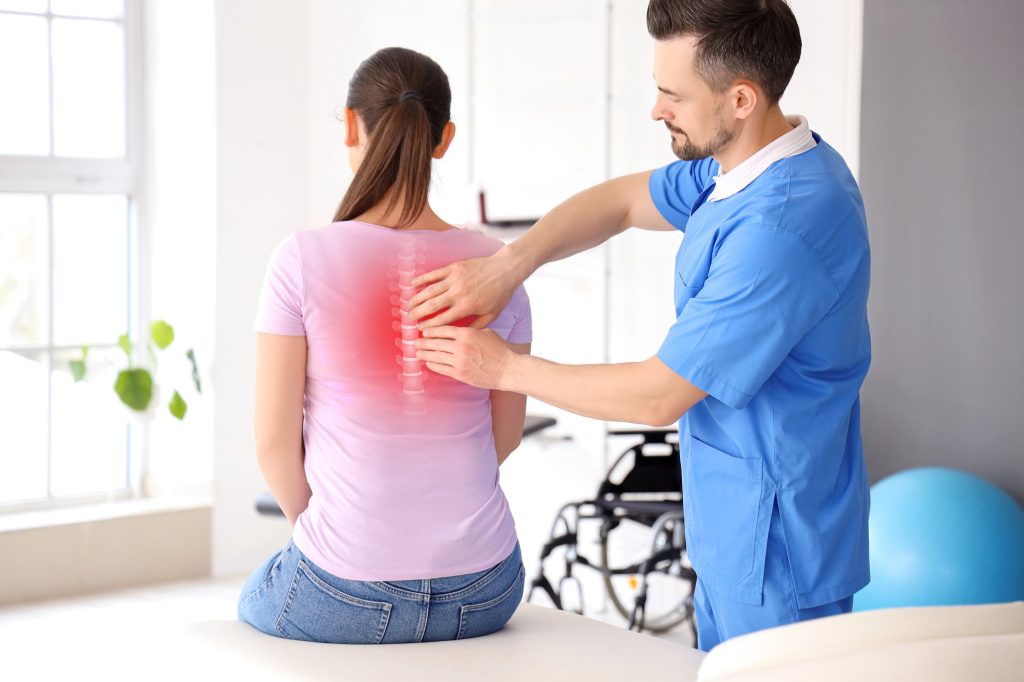 Chiropractic and physiotherapy care - what is the difference? Image of chiropractor adjusting patient's back